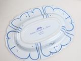 a white plate with a blue and white design on it