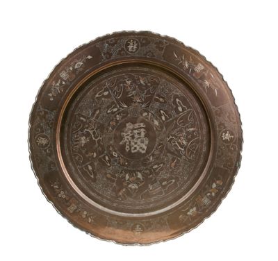 a metal plate with a floral design on it