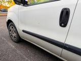 a white van parked on the side of the road