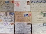 several old letters and envelopes are on a table