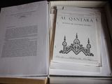 an open book with a picture of a mosque inside of it