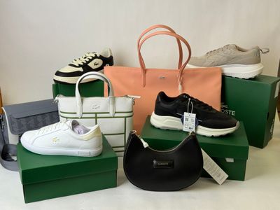 several pairs of shoes, bags and handbags are sitting on a table