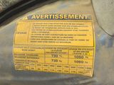 a yellow sticker on the back of a car