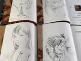 an open book with a drawing of a man and a woman on it
