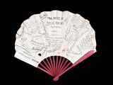 a fan with many writing on it on a black background
