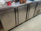 a kitchen counter with a bunch of dishes on top of it