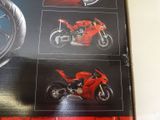 a picture of a picture of a red motorcycle