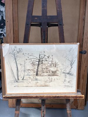 une photo d'un dessin posé sur un chevalet, devant un chevalet
