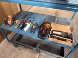 a blue table with a bunch of electronics on top of it