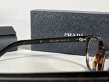 the glasses are on the table next to the box of the glasses