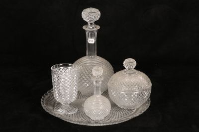 a picture of a glass bottle and a glass vase on a tray