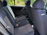 the back seats of a small car are empty in the car
