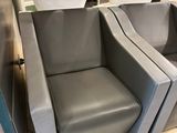 two chairs that are sitting in a room together