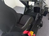 an image of a video game room with a racing simulator