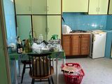 a small kitchen with a table and chairs in it