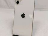 a close up of a white iphone sitting on top of a table