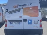 a van that is parked in front of a building