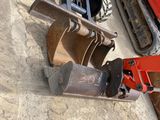 a red bulldozer that is sitting in the dirt