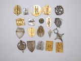 several different types of metal items are arranged on a white surface