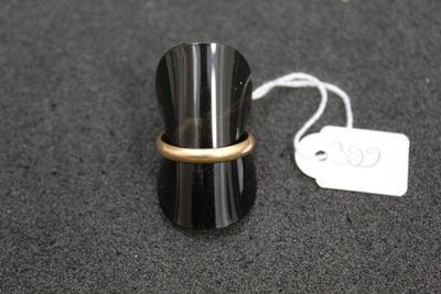 a ring that is on top of a black cup