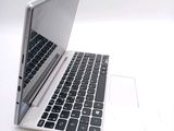 a laptop computer sitting on top of a white table