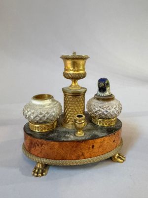 three vases sitting on top of a wooden stand