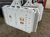 a white machine that is sitting on the ground