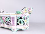 a small decorative box with a floral design on it
