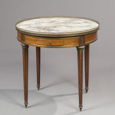 a round marble top table with wooden legs