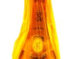 a bottle of champagne that is wrapped in plastic
