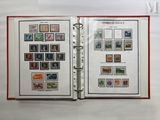 an open book with stamps on it on a table