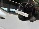 a mirror on the side of a car with a sticker on it