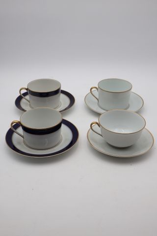 Bernardaud : deux déjeuners en porcelaine or mat et bleu de four,...