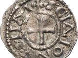 an old silver coin with a cross on it