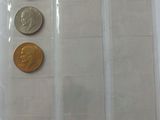five different coins in a plastic bag on a table