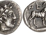 a silver coin with an image of a man on a horse