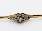 une image d'une broche en or et diamants