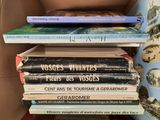 many books stacked on top of each other on a shelf