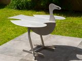 a white bird that is sitting on a table