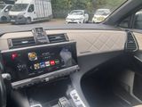 a car dashboard with a digital display in the center