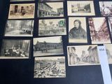 many old photos of people and buildings on the wall