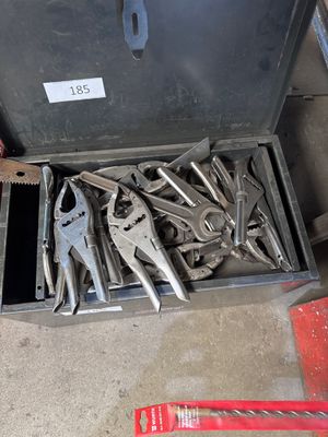 many tools in a tool box on the floor