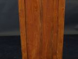 an image of a wooden cabinet with a door on top of it