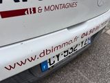 a white van that is parked on the side of the road