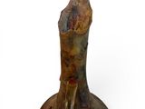 a sculpture of an elephant that is sitting on top of a table