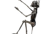 statue of a man sitting on a skateboard holding a skateboard