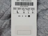a close up of a tag on the back of a sweater