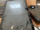 two laptops sitting on a table next to each other