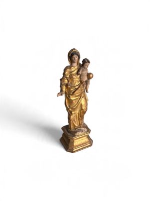 an image of a statue of a woman holding a child