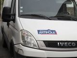 a white van that is parked on the side of the road